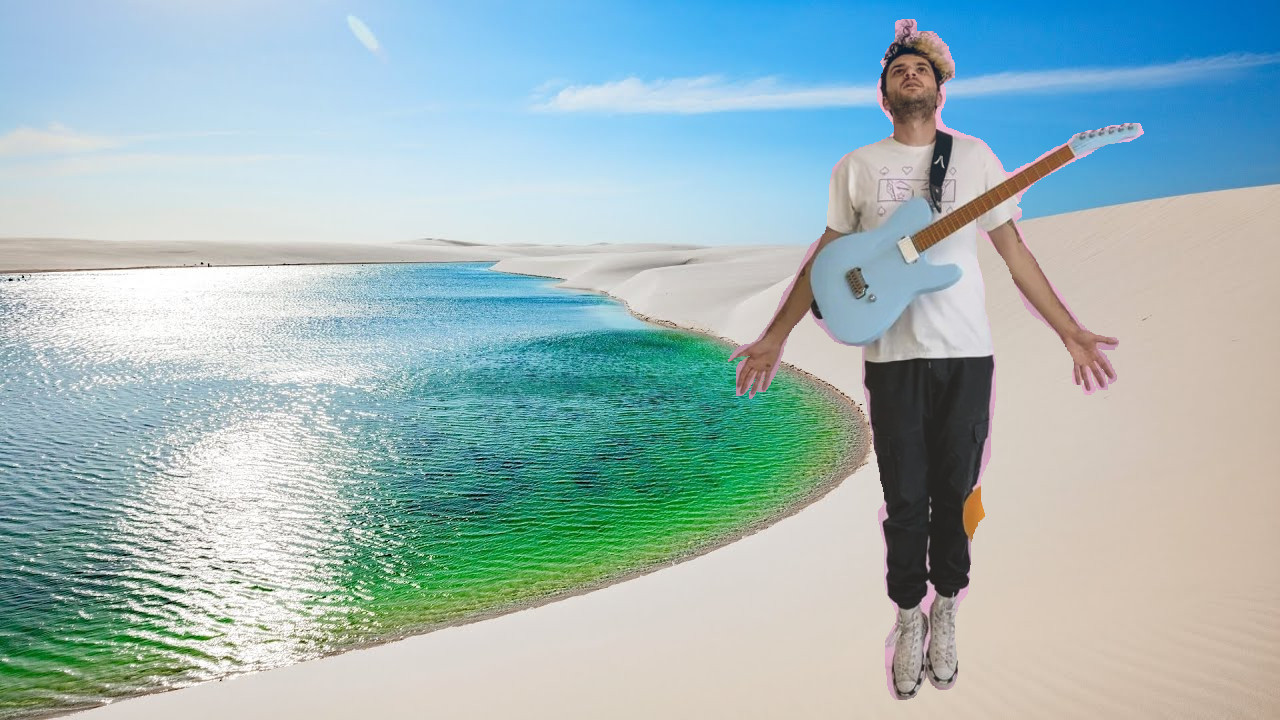 A photoshopped image of the guitarist from the band Standards standing in sand dunes in Brazil