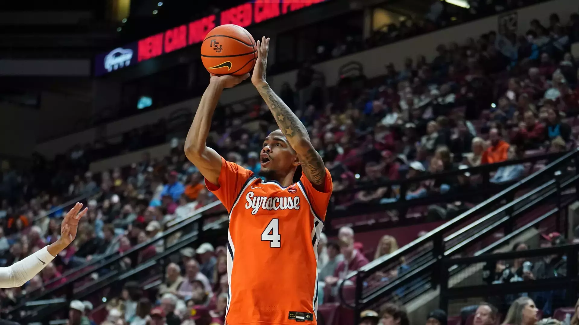 Syracuse basketball player, Chris Bell shooting a jumpshot