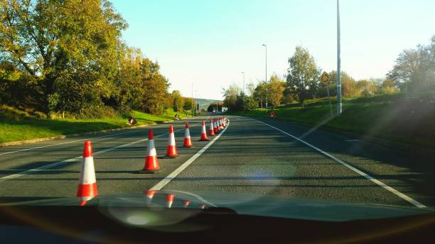 Orange safety cones lining a road